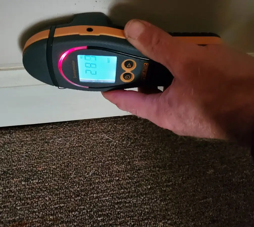 Moisture detection at baseboard during Storm Damage Restoration in New Haven